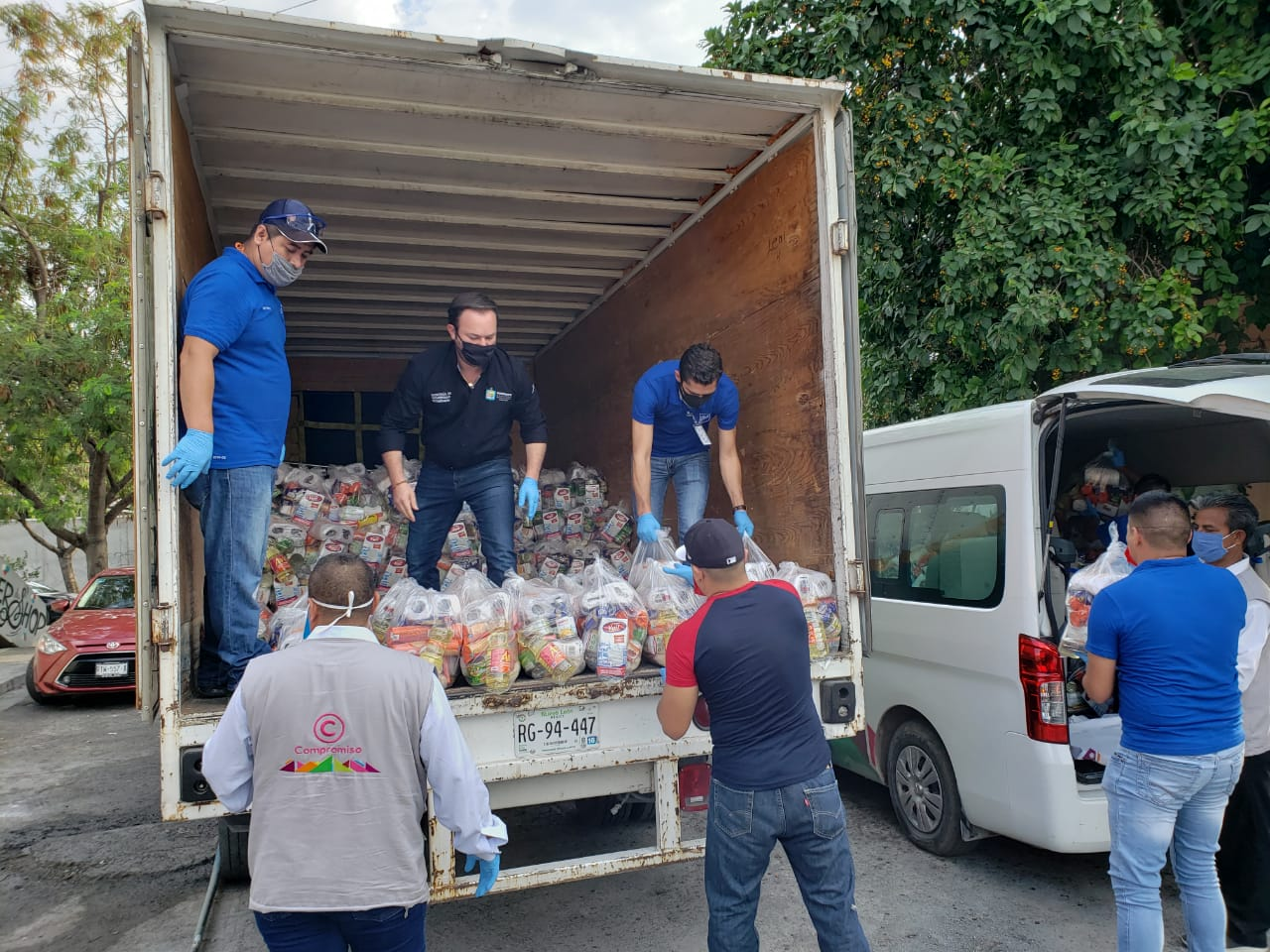 Monterrey Team Delivering Necessities from Truck