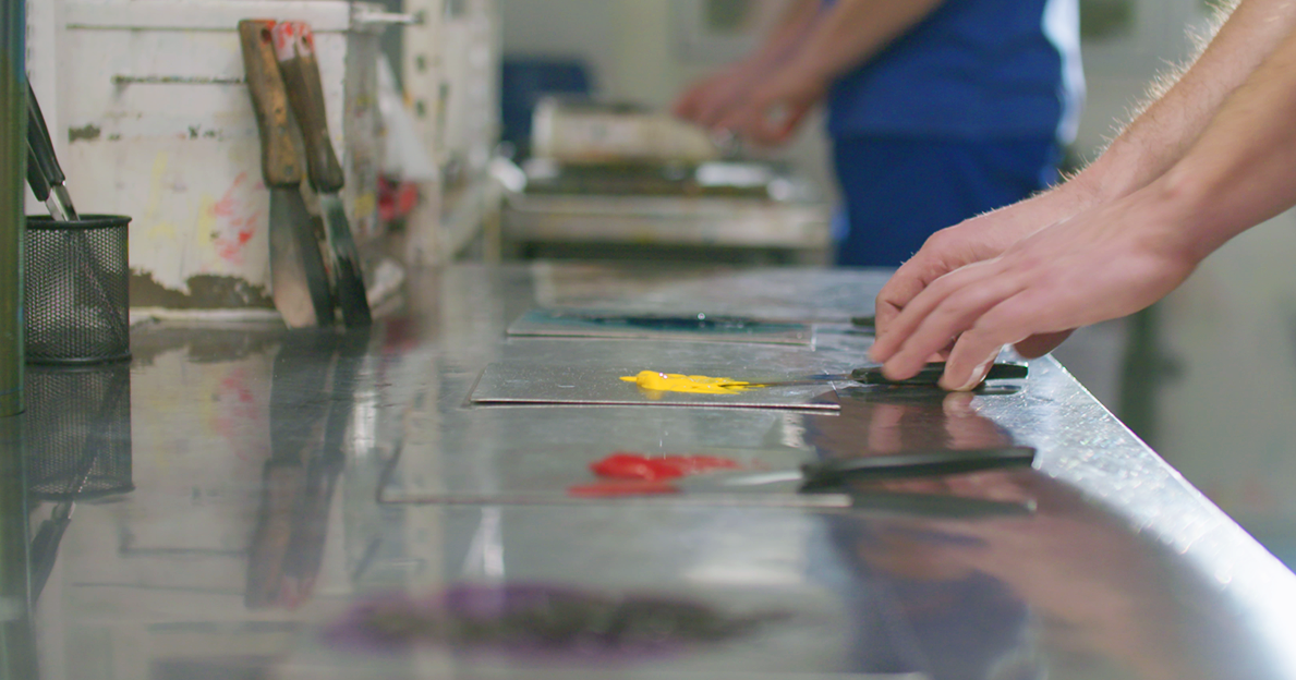 Different color paints on a work surface