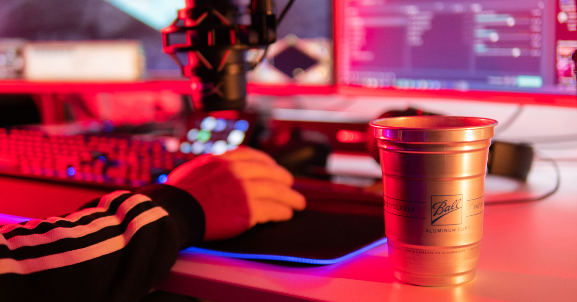 Aluminum Cup next to a DJ