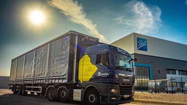 Truck delivering cans