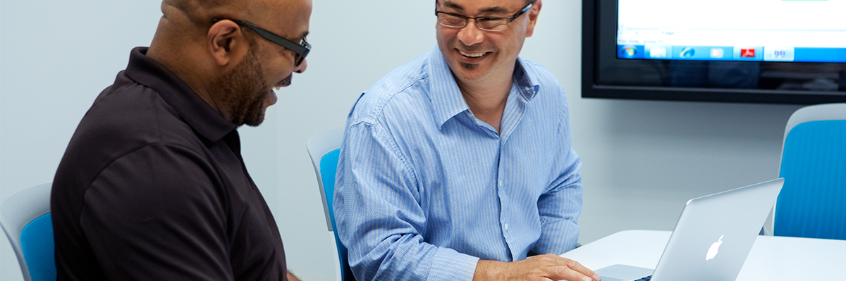 Employees work together in a conference room